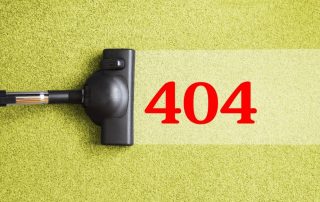 Image of vacuum cleaning up 404 to represent the importance of addressing 404 errors in websites