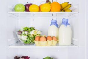 Open refrigerator with fresh milk, eggs and veggies. Understanding the lifespan on content on different platforms is helpful for keeping your content fresh.