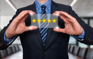 Business person holding a 5 star review.