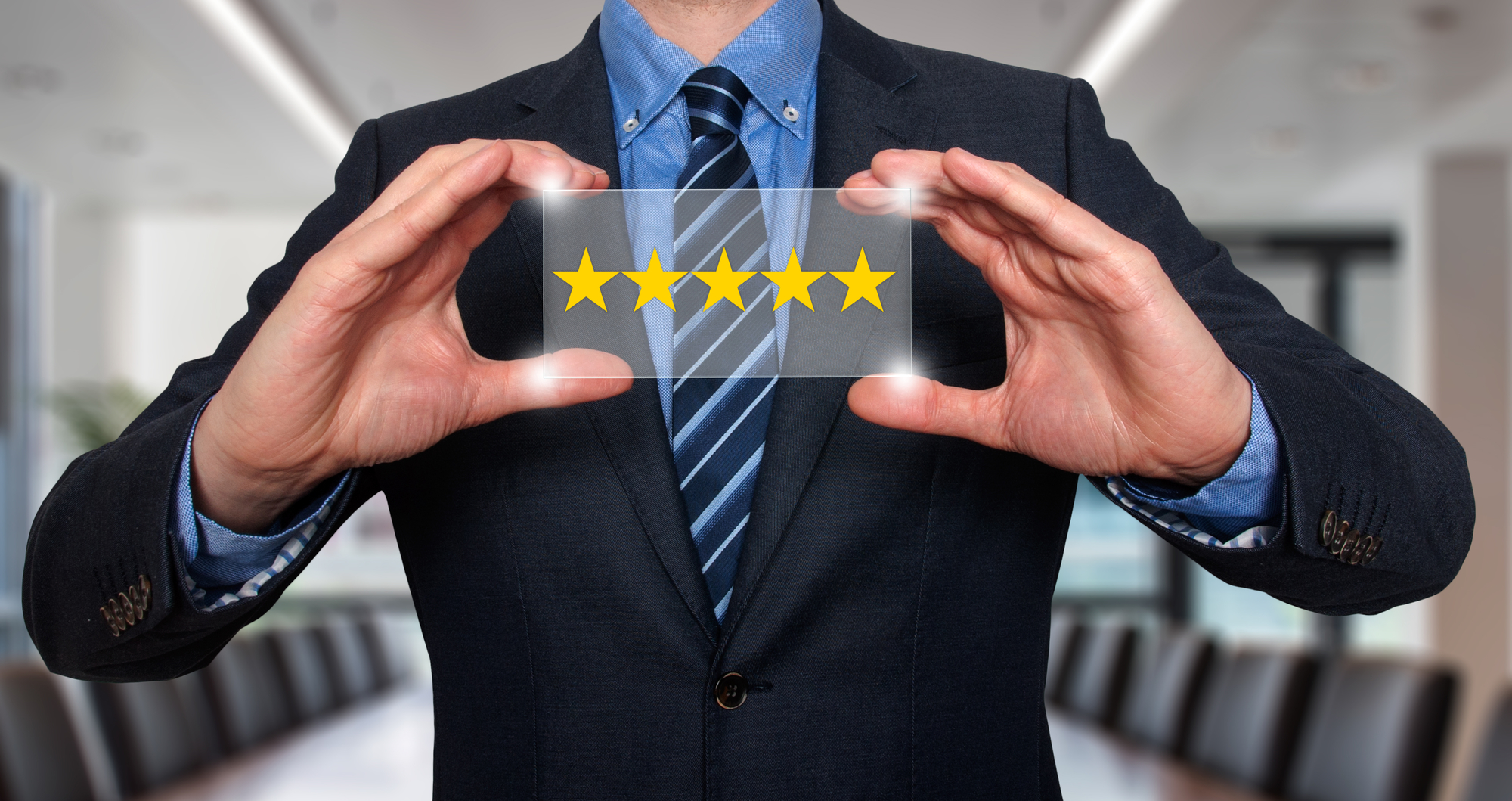 Business person holding a 5 star review.