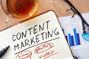Image of content marketer's desk to illustrate the concept of elements of content marketing and their importance