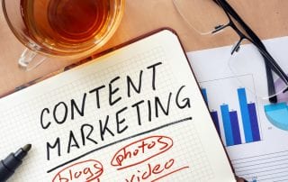 Image of content marketer's desk to illustrate the concept of elements of content marketing and their importance