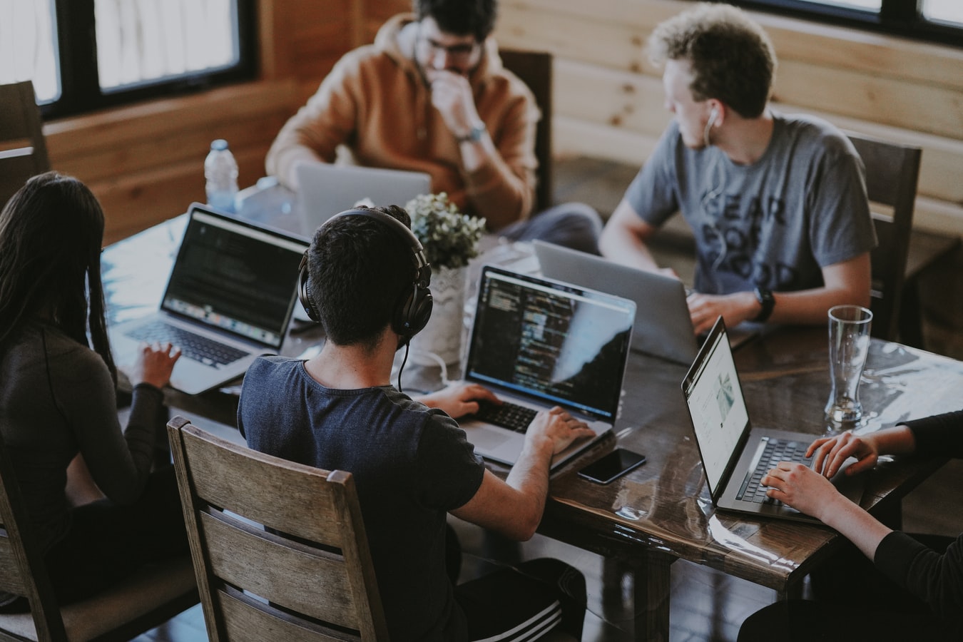 Team of people at a desk collaborating on a nonprofit organization.