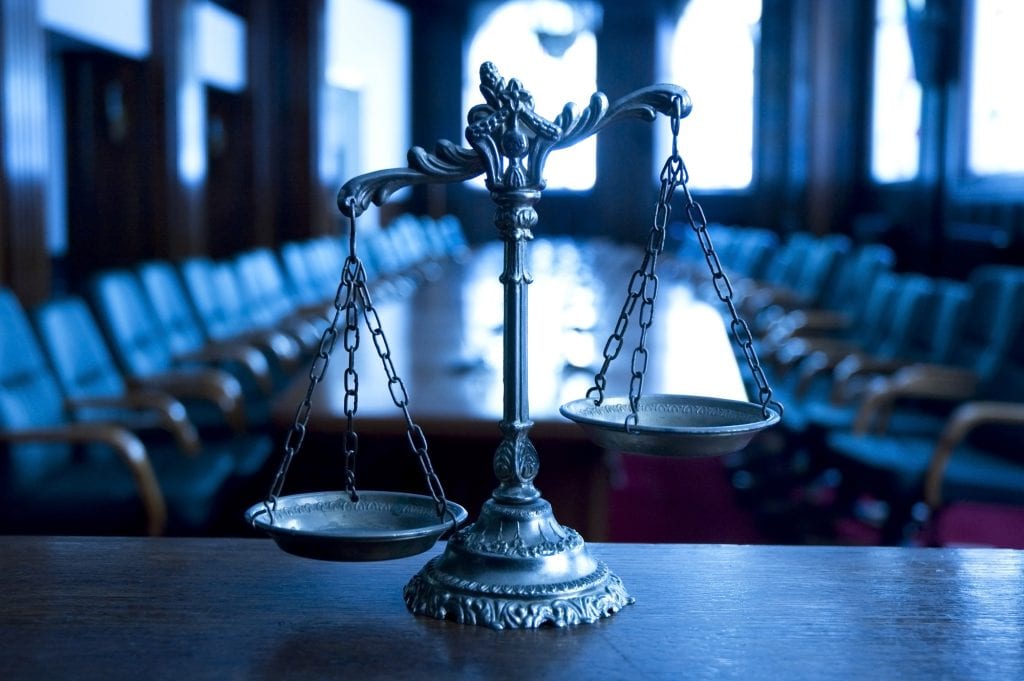 Scales of justice in a courtroom