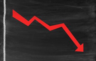 line graph with a red arrow going down